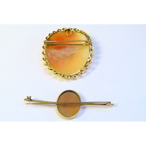 9158 - An unmarked gold cameo brooch and a cameo bar brooch