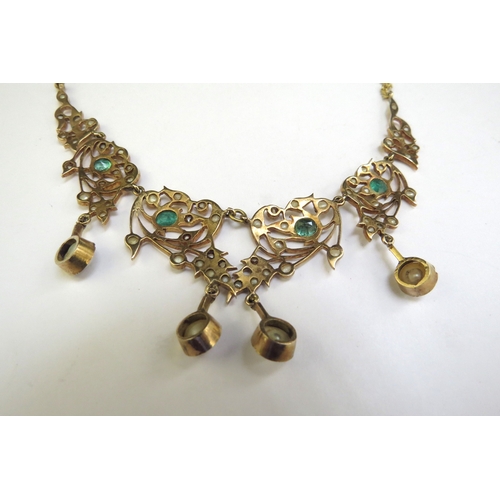 9187 - An emerald and seed pearl studded necklet the central four panels hung with a pearl droplet, on late... 