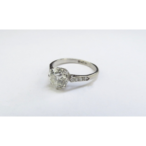 9047 - A diamond solitaire ring 1.50ct diamond approx, with diamond set shoulders, platinum shank. Size O, ... 