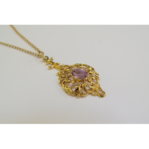 9226 - A 9ct gold chain 62cm long, hung with a scrolled foliate pendant with central amethyst, 4cm drop, 8.... 