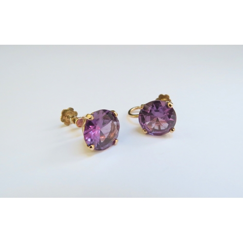 9362 - A pair of synthetic violet sapphire screw back earrings, 5.6g