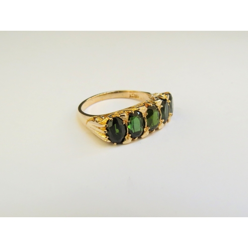 9170 - A 9ct gold five stone tourmaline ring. Size O, 5g