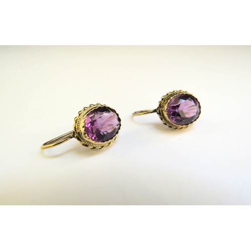 9327 - A pair of amethyst earrings in unmarked gold mount, converted to pull through for pierced ears, 4g  ... 