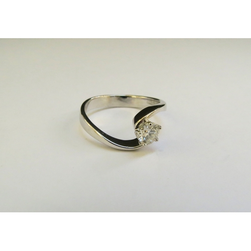 9145 - A white gold diamond solitaire ring the 0.50ct approx diamond in crossover setting, marked 750. Size... 