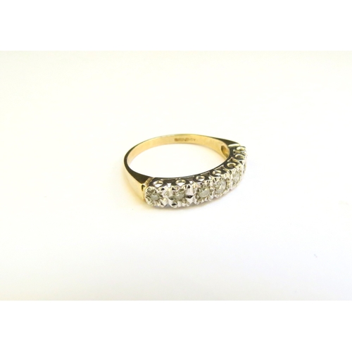 9171 - A 9ct gold illusion set diamond half hoop ring. Size L, 1.9g