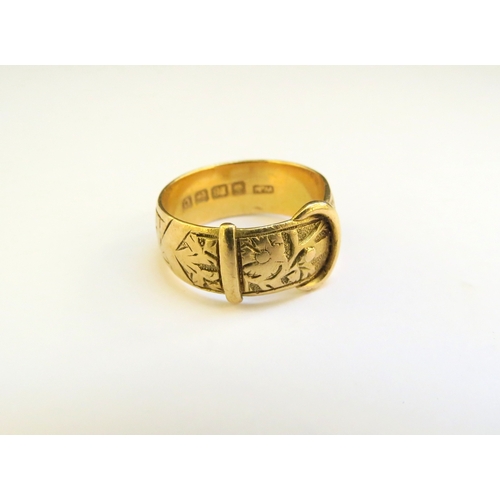 9174 - An 18ct gold engraved buckle ring. Size O, Birmingham 1902, 6.9g  (C)