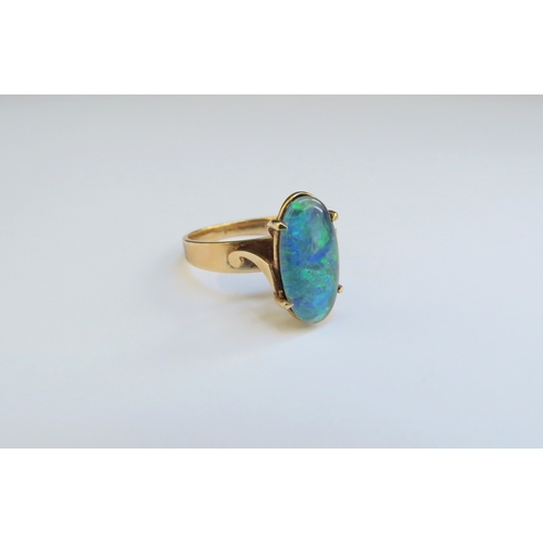 9370 - A gold oval opal ring, etched 9c. Size J/K, 2.6g