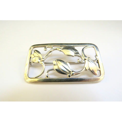 9216 - A Georg Jensen brooch of rounded rectangular form with buds and berries, stamped 925, model 295, 5.5... 