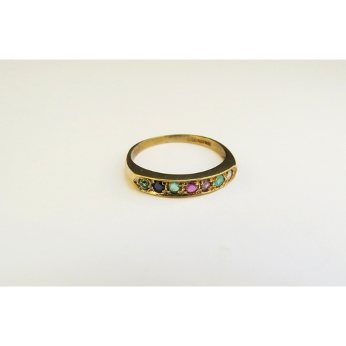 9270 - A 9ct gold ring set with precious stones spelling 