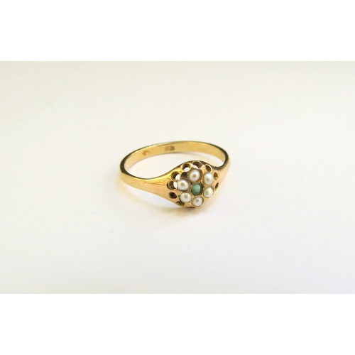 9300 - An emerald and pearl daisy ring, marked 9ct. Size M, 1.6g