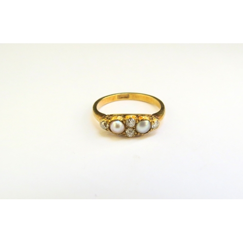 9168 - A pearl and diamond ring, stamped 18ct. Size K, 2.5g