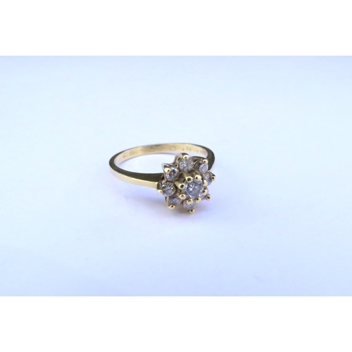 9297 - A diamond daisy ring, stamped 18ct. Size J/K, 3g  (C)