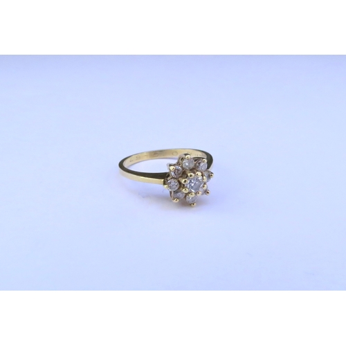 9297 - A diamond daisy ring, stamped 18ct. Size J/K, 3g  (C)