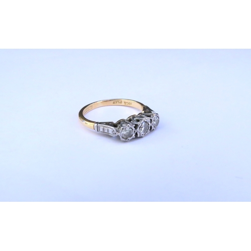 9298 - A three stone diamond ring, stamped 18ct/plat. Size J/K, 2.6g  (C)