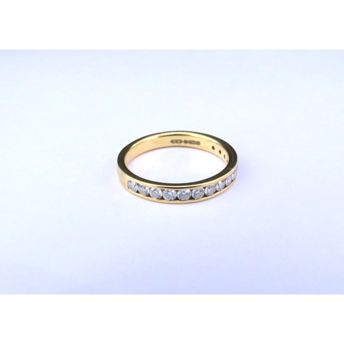 9150 - An 18ct gold half hoop diamond ring in channel setting. Size M/N, 3g  (C)