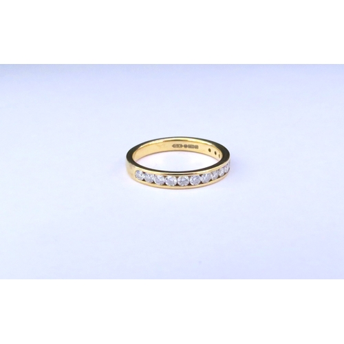 9150 - An 18ct gold half hoop diamond ring in channel setting. Size M/N, 3g  (C)