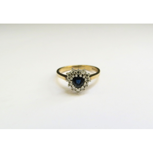 9253 - A 9ct gold sapphire and diamond heart shaped ring. Size K/L, 2.4g