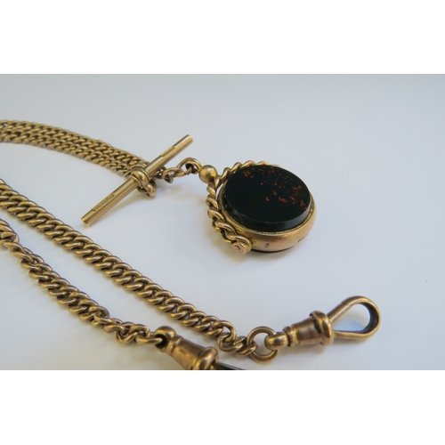 9075 - A 9ct gold watch chain with T-bar and hung with a bloodstone and cornelian swivel fob, 39cm long, 40... 