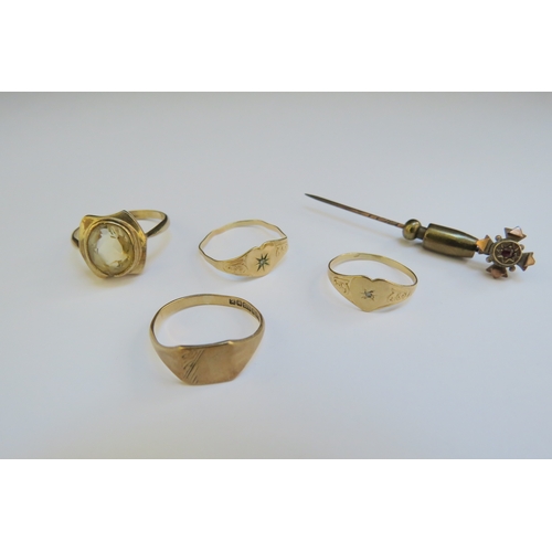 9323 - Four gold rings including two 9ct gold examples one with citrine, all a/f, and a 9ct stick pin, 5g