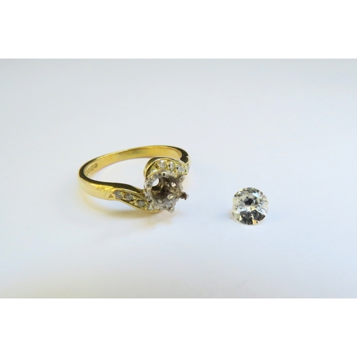 9313 - An 18ct gold crossover ring shank, the centre diamond loose and damaged, diamond set shoulders. Size... 