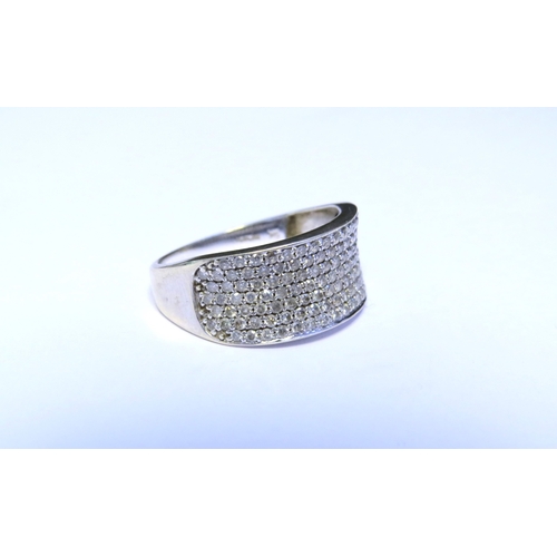 9190 - A 9ct white gold multi-stone diamond half hoop ring. Size Q/R, 3.4g