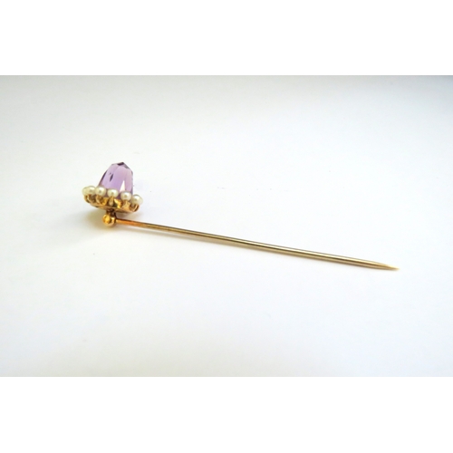 9366 - An unmarked gold amethyst and pearl stick pin, one pearl missing, 3.8g