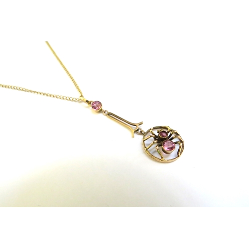 9306 - A 9ct gold negligee necklace of a spider set with pink stones, hung on chain, 46cm long, 2.5g