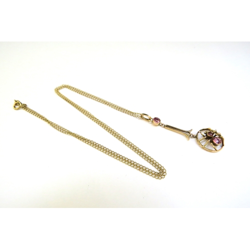 9306 - A 9ct gold negligee necklace of a spider set with pink stones, hung on chain, 46cm long, 2.5g