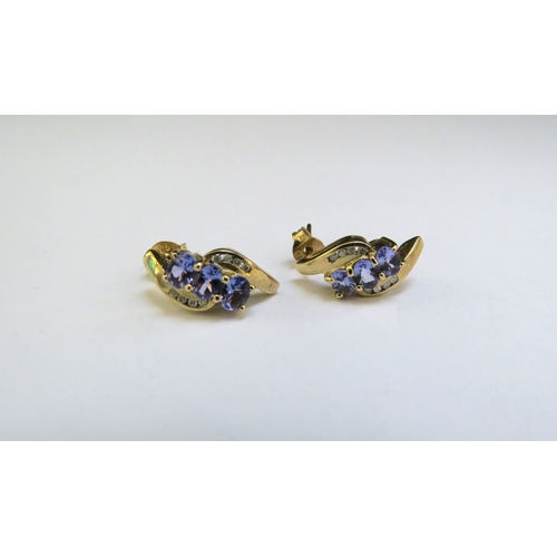 9283 - A pair of 9ct gold tanzanite and diamond earrings, 2.5g