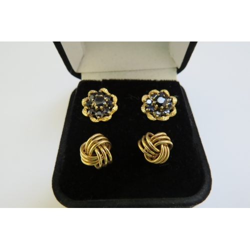 9303 - A pair of 9ct gold sapphire cluster earrings and a pair of 9ct gold knot earrings, 5.7g