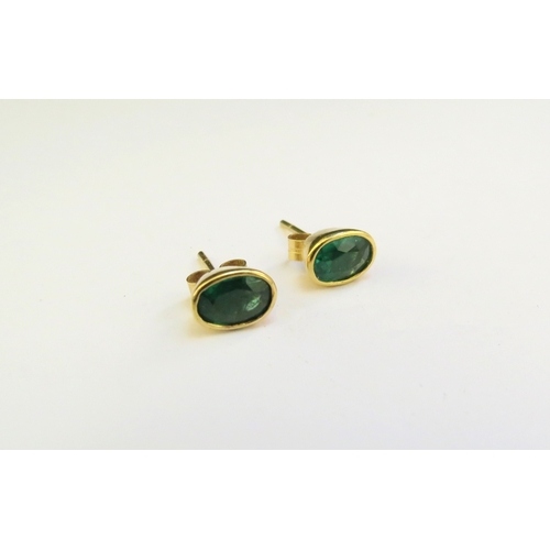 9315 - A pair of emerald oval stud earrings, 2.2g