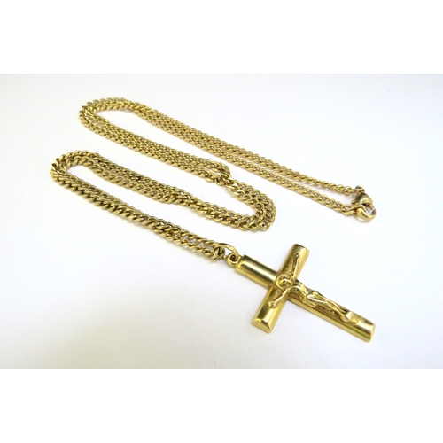 9263 - A gold chain, 60cm long stamped 585 hung with a gold crucifix marked 750, 17.7g total