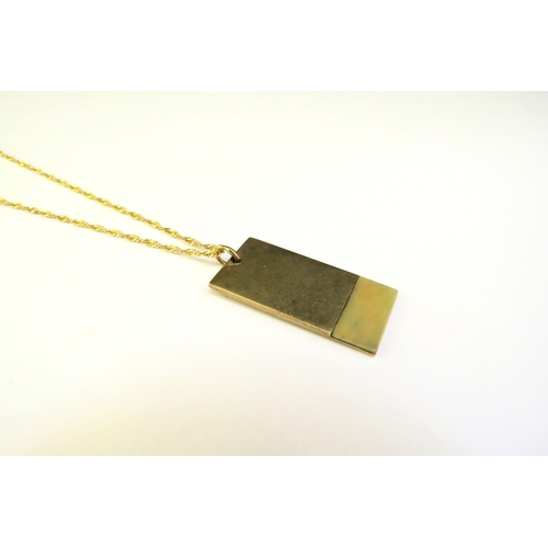 9372 - A 9ct gold pendant, 6.3g hung on a gold chain stamped 14k, 44cm long, 1.5g