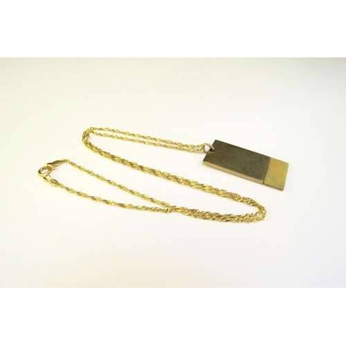 9372 - A 9ct gold pendant, 6.3g hung on a gold chain stamped 14k, 44cm long, 1.5g