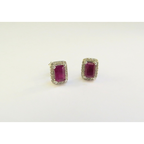 9013 - A pair of 18ct white gold ruby and diamond earrings