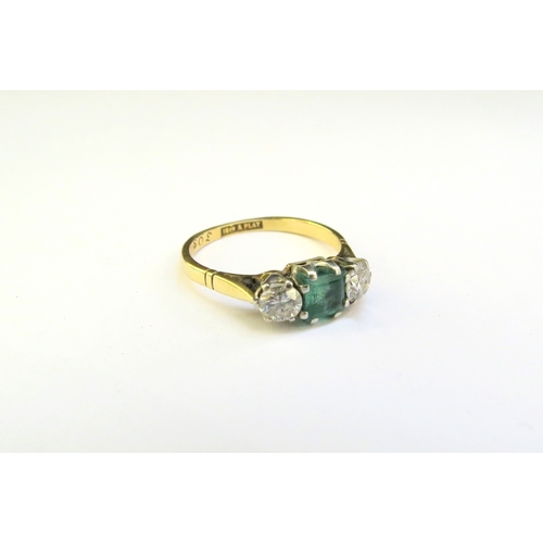 9288 - An emerald and diamond ring, the central square cut emerald 5mm x 5mm flanked by 0.22ct approx diamo... 