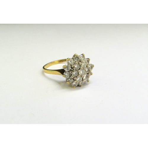 9062 - A gold diamond cluster ring, stamped 18ct. Size Q, 5.4g