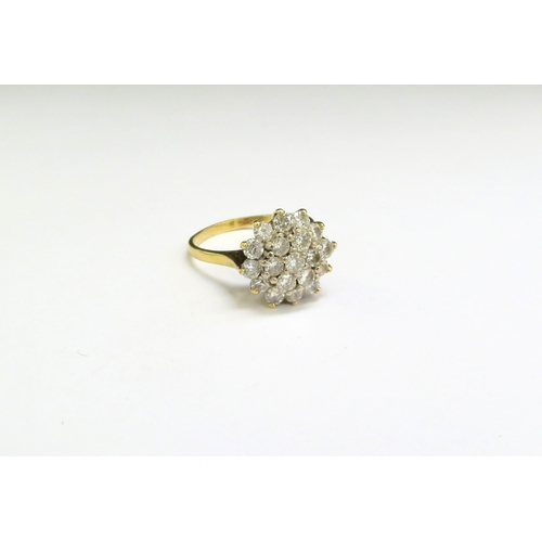 9062 - A gold diamond cluster ring, stamped 18ct. Size Q, 5.4g