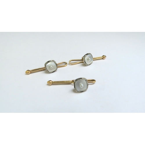 9106 - Three Cartier gold and Mother-of-pearl dress studs, stamped 14k, 3.5g  (C)