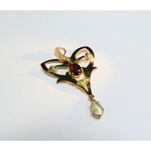 9119 - An Edwardian gold pendant with garnet and pearl drop, stamped 9ct, 106g