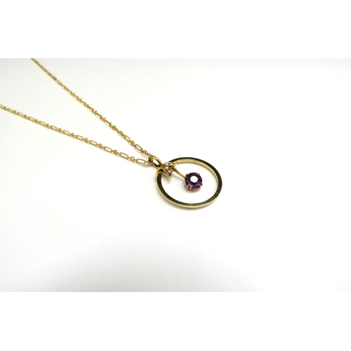 9104 - A gold chain, unmarked, 43cm long hung with an amethyst and pearl pendant in circular frame, stamped... 