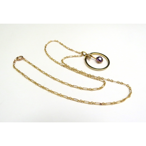 9104 - A gold chain, unmarked, 43cm long hung with an amethyst and pearl pendant in circular frame, stamped... 