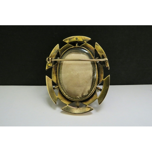 9118 - A Victorian onyx cameo brooch, the frame set with six pearls, frame unmarked, glass panel reverse, 5... 