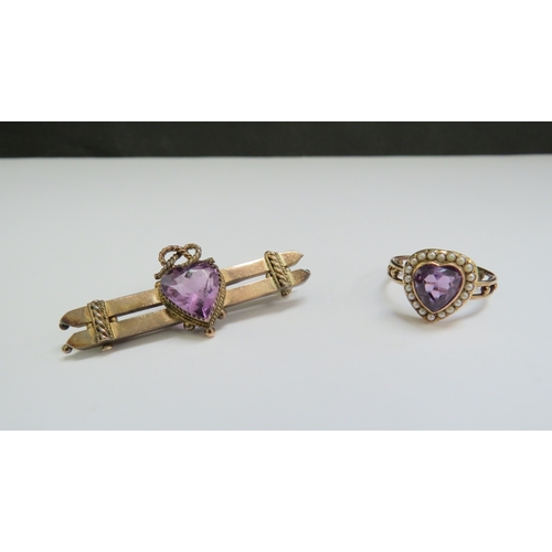 9079 - An amethyst and seed pearl ring as a heart. Size O, and a similar bar brooch with amethyst coloured ... 