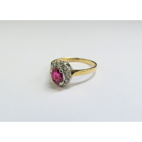 9024 - A ruby and diamond cluster ring, marks rubbed. Size L, 2.1g