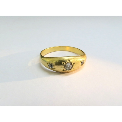 9083 - A gold gypsy ring set with three diamonds in star setting, unmarked. Size S, 3.2g  (C)