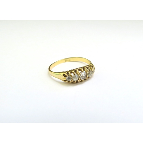 9107 - A gold five stone diamond ring, stamped 18ct. Size M, 2.6g (C)