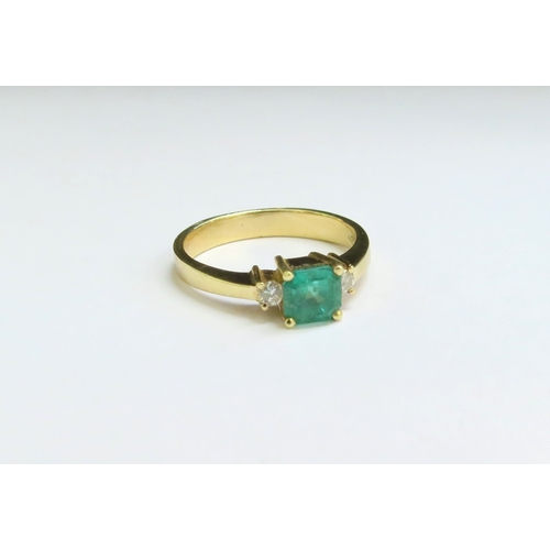 9056 - An emerald and diamond ring, the central square cut emerald 5mm x 5mm flanked by brilliant cut diamo... 