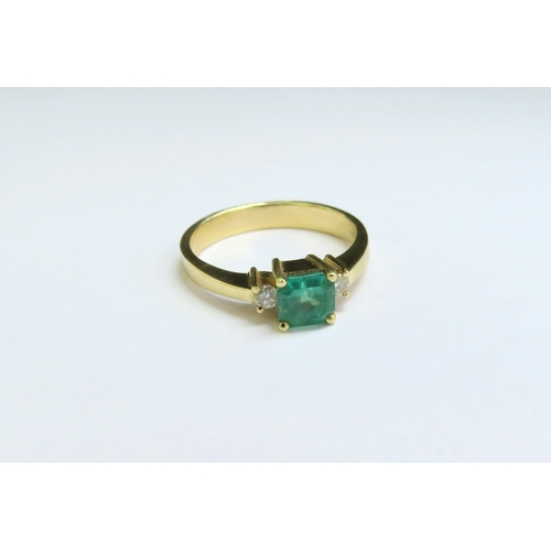 9056 - An emerald and diamond ring, the central square cut emerald 5mm x 5mm flanked by brilliant cut diamo... 