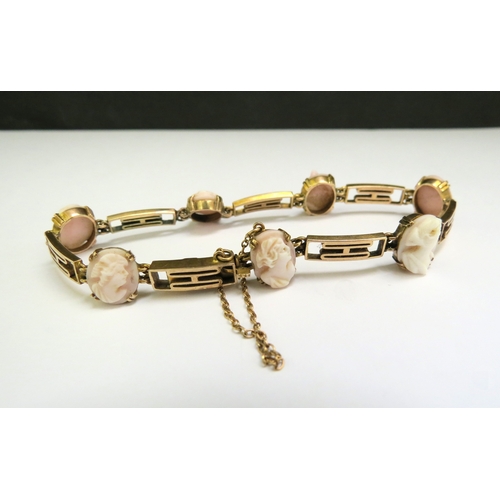 9085 - A gold bracelet spaced with seven cameo ovals, stamped 9ct, 18cm long, 9.3g  (C)